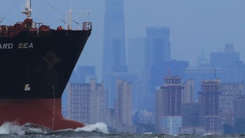 The Leopard Sea, a chemical and oil tanker ship, sails in front of the skyline of lower Manhattan in New York City on September 8, 2018. (Gary Hershorn/Getty Images) 
