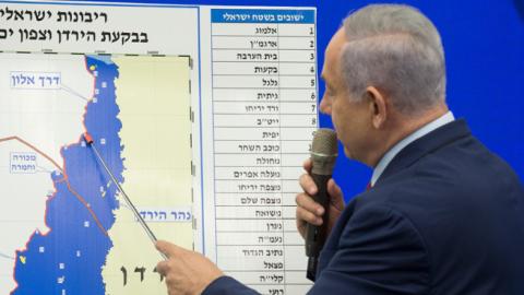 Israeli Prime Minster Benjamin Netanyahu points to a Jordan Valley map during his announcement on September 10, 2019 in Ramat Gan, Israel. (Amir Levy/Getty Images)