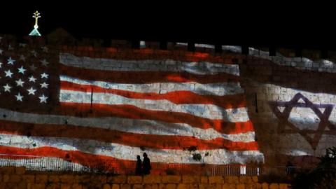 The Israeli and United States flags are projected on the walls of the ramparts of Jerusalem's Old City, to mark one year since the transfer of the US Embassy from Tel Aviv to Jerusalem on May 15, 2019. (AHMAD GHARABLI/Getty Images)