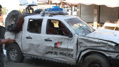 Afghan Security personnel inspect the scene of a suicide bomb blast targeted a Police vehicle on the outskirts of Jalalabad, Afghanistan, 13 June 2019. (Wali Sabawoon/NurPhoto via Getty Images)