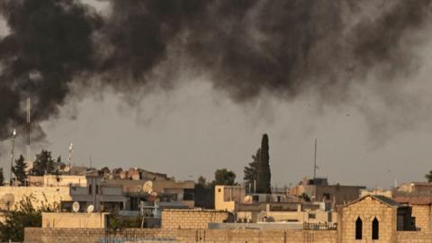 Smoke billows following Turkish bombardment on Syria’s northeastern town of Ras al-Ain in the Hasakeh province along the Turkish border on October 9, 2019.  (DELIL SOULEIMAN/AFP/Getty Images)