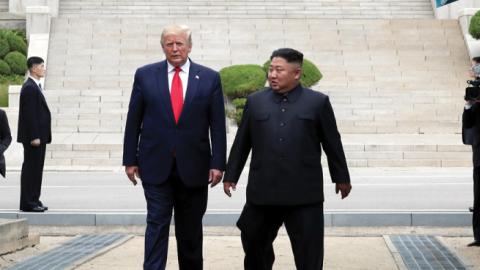 A handout photo provided by Dong-A Ilbo of North Korean leader Kim Jong Un and U.S. President Donald Trump inside the demilitarized zone (DMZ) separating the South and North Korea on June 30, 2019. (Dong-A Ilbo/Getty Images)