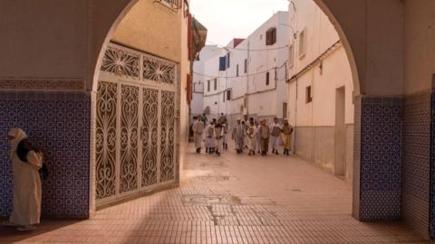 Students from an Islamic school walk near the Great Mosque of Sale near the capital of Rabat. (FADEL SENNA/AFP via Getty Images)