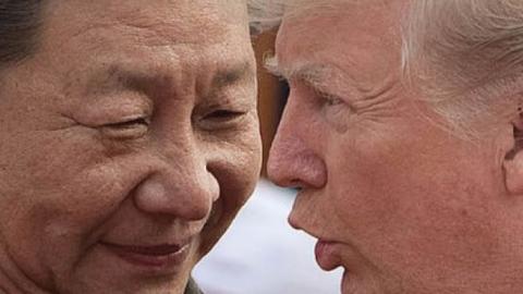 China's President Xi Jinping (L) and US President Donald Trump attend a welcome ceremony at the Great Hall of the People in Beijing on November 9, 2017