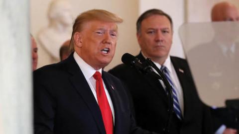 U.S. President Donald Trump speaks from the White House as Secretary of State Mike Pompeo listens on January 08, 2020 in Washington, DC