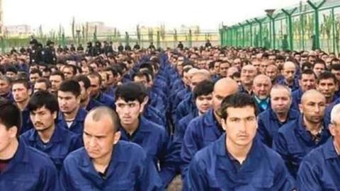 Uighur men in a reeducation camp in Xinjiang province