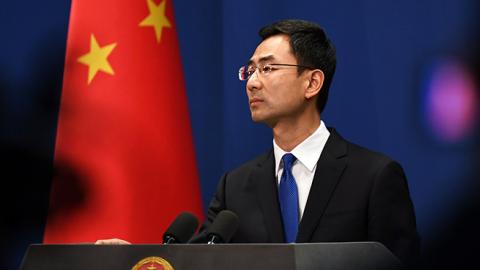 Chinese Foreign Ministry spokesman Geng Shuang speaks during the daily press briefing in Beijing on March 18, 2020. (GREG BAKER/AFP via Getty Images)
