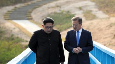 North Korean leader Kim Jong-un and South Korean President Moon Jae-in talk in private during the Inter-Korean Summit on April 27, 2018 in Panmunjom, South Korea. (Inter-Korean Press Corp/NurPhoto via Getty Images)