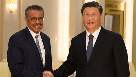 Tedros Adhanom, Director General of the World Health Organization shakes hands with Chinese President Xi Jinping before a meeting at the Great Hall of the People, on January 28, 2020 in Beijing, China. (Naohiko Hatta/Getty Images)