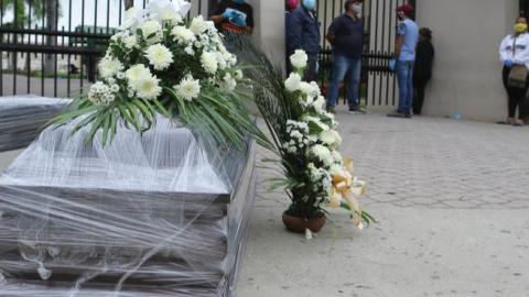Relatives of the deceased line up for a funeral in Guayaquil, Ecuador, a city hit hard by the coronavirus, April 5.