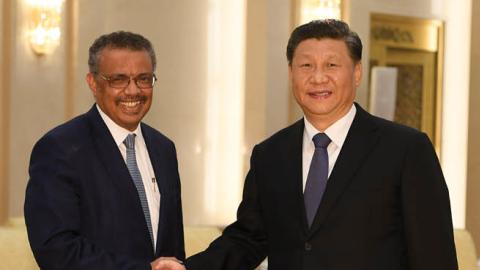 Tedros Adhanom, Director General of the World Health Organization, (L) shakes hands with Chinese President Xi Jinping before a meeting at the Great Hall of the People, on January 28, 2020 in Beijing, China. 