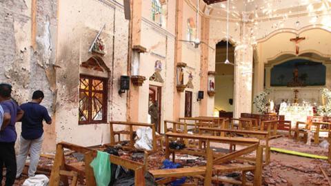 Sri Lankan officials inspect St. Sebastian's Church in Negombo, north of Colombo, after multiple explosions targeting churches and hotels across Sri Lanka on April 21, 2019, in Negombo, Sri Lanka.