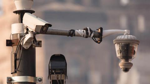 CCTV security camera against Shanghai bund historic building.