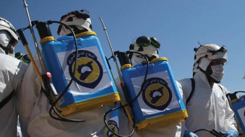 Members of the Syrian civil defence, also known as the White Helmets, prepare their sterilisation equipment before a sterilization campaign for hospitals in the city of Idlib against the Coronavirus (COVID-19) pandemic, after the emergence of suspected ca