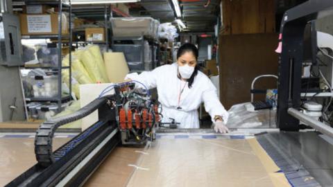 An employee inside Ferrara Manufacturing makes masks during the coronavirus pandemic on April 6, 2020 in New York City.