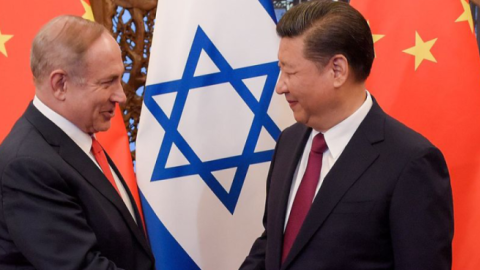 China's President Xi Jinping and Israel's Prime Minister Benjamin Netanyahu shake hands ahead of their talks at Diaoyutai State Guesthouse in Beijing on March 21, 2017. (ETIENNE OLIVEAU/AFP via Getty Images)