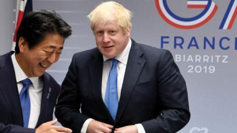 U.K. Prime Minister Boris Johnson meets with Japanese Prime Minister Shinzo Abe on day three of the G-7 Summit in Biarritz, France, on Aug. 26, 2019.