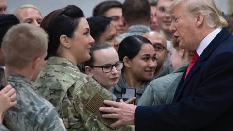 US President Donald Trump greets members of the US military during a stop at Ramstein Air Base in Germany, on December 27, 2018.