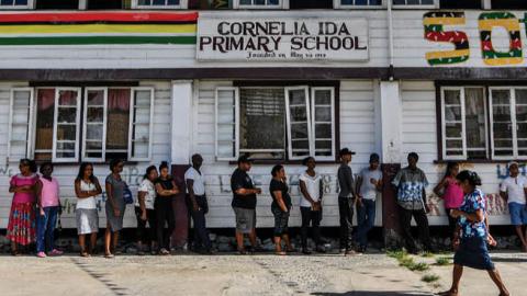 Guyanese citizens line up to vote, in Leonora, Guyana on March 2, 2020. 
