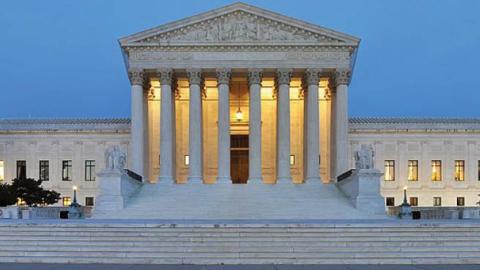 Panorama of the west facade of United States Supreme Court Building at dusk in Washington, D.C., USA.