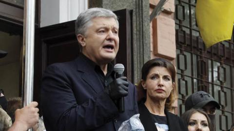 Former Ukrainian President Petro Poroshenko speaks to his supporters near a district court in Kiev, Ukraine, on June 18, 2020.