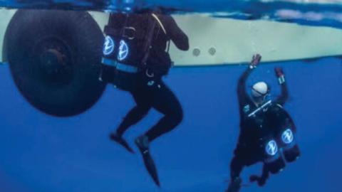 Seabee divers perform maintenance on undersea cables at the Pacific Missile Range Facility Barking Sands, Hawaii. Much of the globe's military and civilian electronic messages flow through undersea cables.