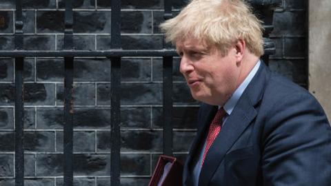 British Prime Minister Boris Johnson leaves 10 Downing Street for PMQs at the House of Commons on 15 July, 2020 in London, England.