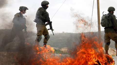 Israeli soldiers stand during clashes with Palestinians at a protest against Jewish settlements in the village of Oref in the Israeli-occupied West Bank, February 15, 2019. (Mohamad Torokman/Reuters)