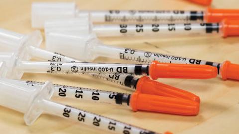 Needles for illegal drug injection on display during a news conference announcing three safe injection sites for the city in Toronto, Ontario.