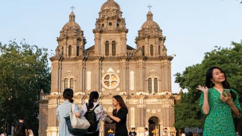 People outside St Joseph's Church (also known as Wangfujing Church) of the Roman Catholic Church in Dongcheng District of Beijing during the pandemic of the novel coronavirus disease (COVID-19)