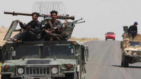 Afghan security officials patrolled a highway in the southern province of Helmand in August. The province is a Taliban stronghold.