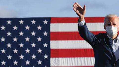 Democratic presidential nominee and former Vice President Joe Biden waves to supporters before speaking at a Drive-In rally at Dallas High School, in Dallas, Pennsylvania, on October 24, 2020.
