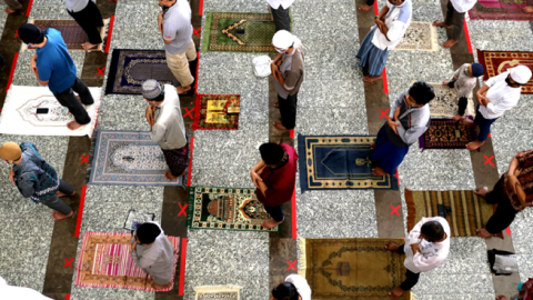 Indonesian Muslims wearing masks and maintaining social distance perform Friday prayer at the At-Tin Grand Mosque in Jakarta, Indonesia on June 5, 2020. (Eko Siswono Toyudho/Anadolu Agency via Getty Images)