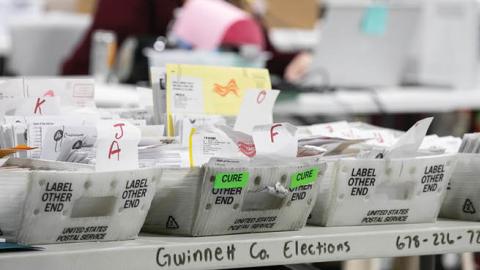 Gwinnett County workers continue to count absentee and provisional ballots at the Gwinnett Voter Registrations and Elections office on November 6, 2020 in Lawrenceville, Georgia.