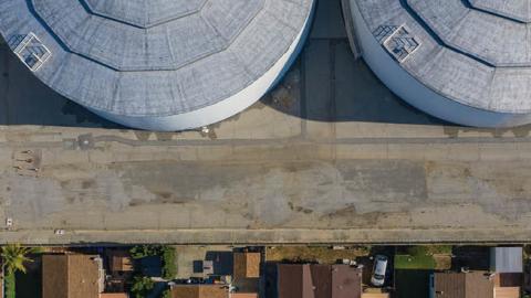 An aerial view shows homes near the Dominguez Hill Tank Farm Oil Storage Terminal.