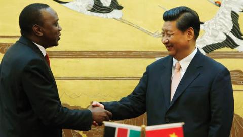 Kenyan President Uhuru Kenyatta (3rd L) and his Chinese President Xi Jinping (3rd R) shake hands during a signing ceremony for a visa exemption agreement in the Great Hall of the People August 19, 2013 in Beijing,