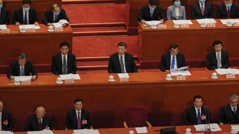 President Xi Jinping, Chinese Premier Li Keqiang, and member of the Standing Committee of the Politburo Li Zhanshu and other attendees sit at the beginning of the Chinese People's Political and Consulting Conference on May 21, 2020
