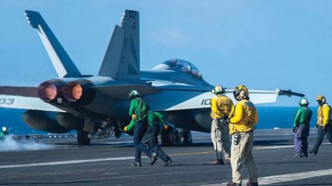 An F/A-18F Super Hornet takes off from the USS Theodore Roosevelt in the South China Sea, Jan. 23.