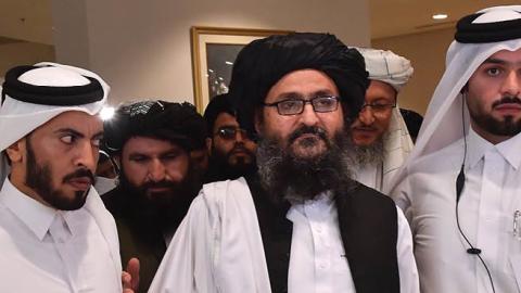 Taliban co-founder Mullah Abdul Ghani Baradar leaves after signing an agreement with the United States during a ceremony in the Qatari capital Doha on February 29, 2020.