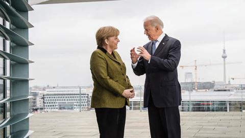 German Chancellor Angela Merkel speaks with US Vice President Joe Biden at the start of their meeting at the Chancellery on February 1, 2013 in in Berlin, Germany. 