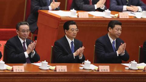 Chinese Premier Wen Jiabao and incoming-Premier Li Keqiang applaud during the closing session of the annual CPPCC held at the Great Hall of the People on March 12, 2013 in Beijing, China