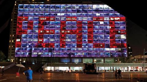 The windows of the Tel Aviv-Yafo Municipality building illuminated with the word "Peace" on September 15, 2020 to celebrate the signing of the landmark Israeli normalisation deals with the UAE and Bahrain. (Photo by JACK GUEZ/AFP via Getty Images)