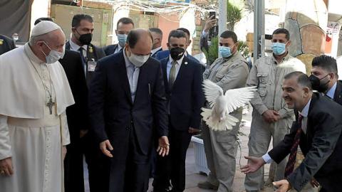 Pope Francis is welcomed by a dove's flight as he arrives in Najaf for a meeting with Grand Ayatollah Sayyid Ali Al-Husayni Al-Sistani on March 06, 2021 in Najaf, Iraq. (Vatican Pool via Getty Images)