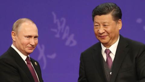 Russian President Vladimir Putin, left, shakes hands with Chinese President Xi Jinping, right, during the Tsinghua Universitys ceremony, at Friendship palace on April 26, 2019 in Beijing, China. (Photo by Kenzaburo Fukuhara - Pool/Getty Images)