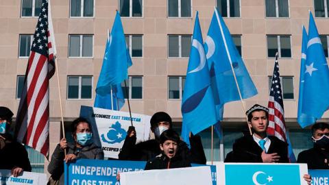Uyghurs of the East Turkistan National Awakening Movement (ETNAM) hold a rally outside the US State Department calling on US President Joe Biden to increase pressure on the Chinese Communist Party, on February 5, 2021 in Washington, DC. (Photo by ALEX EDE
