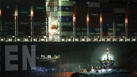 A general view of "Ever Given", a container ship operated by the Evergreen Marine Corporation which is currently stuck in the Suez canal, during a tugging attempt to re-float it (Photo by Fadell Dawod/picture alliance via Getty Images) 