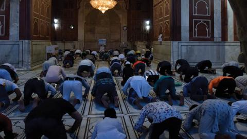 Muslim devotees offer namaz on the eve of Ramzan on April 13, 2021 in New Delhi, India. (Photo by Sanjeev Verma/ Hindustan Times via Getty Images)