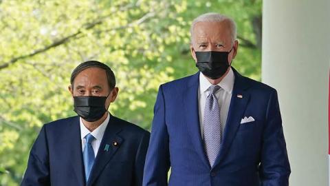 US President Joe Biden and Japan's Prime Minister Yoshihide Suga walk through the Colonnade to take part in a joint press conference in the Rose Garden of the White House in Washington, DC on April 16, 2021 (Photo by MANDEL NGAN/AFP via Getty Images)