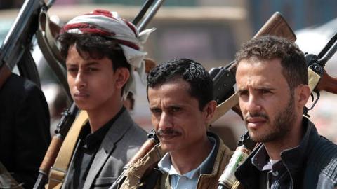 Houthi rebel fighters hold their weapons during a gathering aimed at mobilizing more fighters before heading to battlefronts (Photo by Hani Al-Ansi/picture alliance via Getty Images)