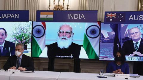 A virtual meeting of the "Quad" alliance members (Photo by OLIVIER DOULIERY/AFP via Getty Images)